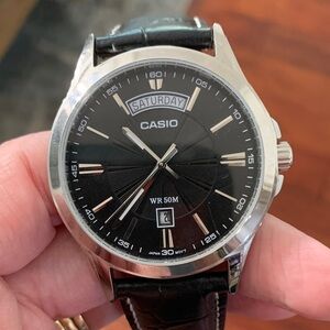 Casio Black and Silver Watch with Day Display